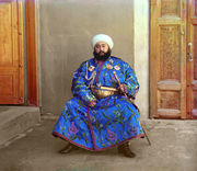 Alim Khan's bemedaled robe is a social message